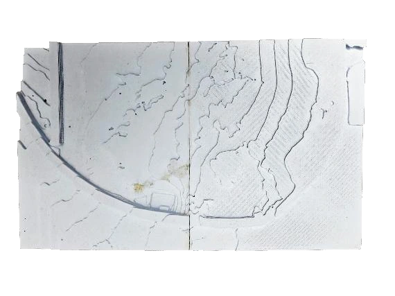 Contour model. A physical terrain study tests how the pavilion meets the slope rather than an abstract flat plane.